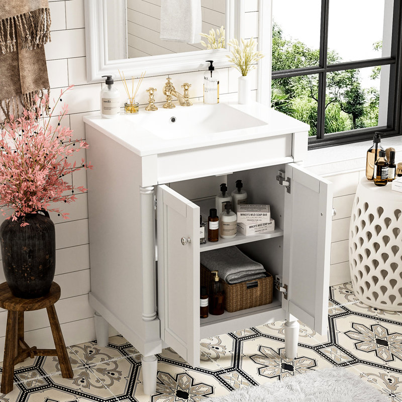 Meuble-lavabo 24 po. Style moderne. Lavabo en céramique. Blanc. Vaste espace de rangement. Charnières. Meuble-lavabo à poignée en métal exquis. Cadre. Tableaux. Grand rangement. Robinet de 4 po