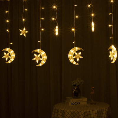 Arlmont & Co. 138 LED Curtain String Light LED Crescents And Stars Transparent Strand 8 Lighting Modes For Wall Curtain Home Decoration