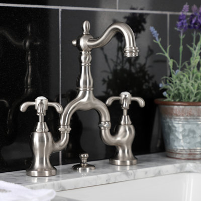 Kingston Brass French Country Two-Handle 3-Hole Deck Mount Bridge Bathroom Faucet with Brass Pop-Up
