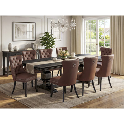 9-piece dining room set includes a dining table and 8 Burgundy Polyester fabric dining Chairs with Button Tufted Chair Back - Sand Blasting Black Finish