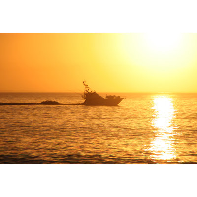 Sport fishing boat at sunrise