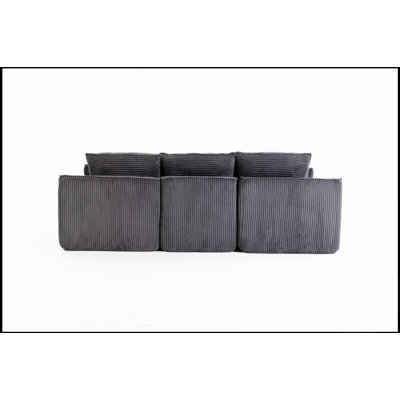 Canapé d'angle modulaire compressé en forme de L avec repose-pieds amovible et coussins nuage détachables, idéal pour les espaces de vie modernes.