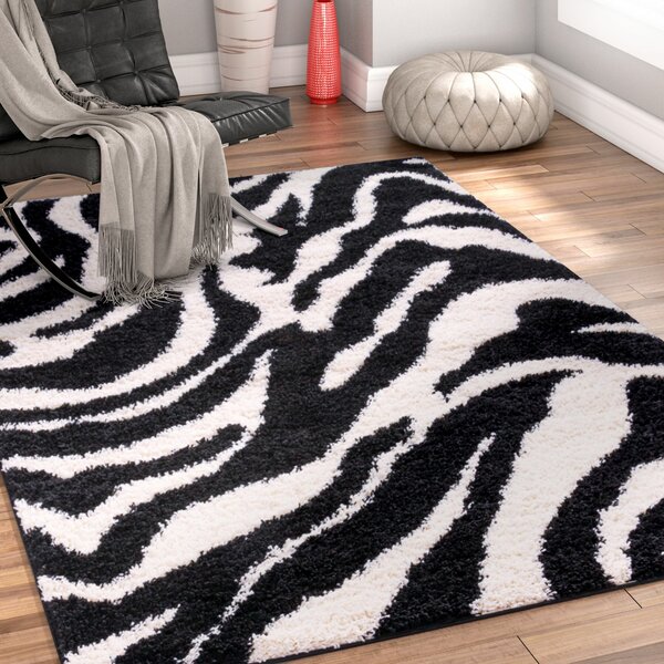 Ebern Designs Dondre Animal Print Black Area Rug & Reviews | Wayfair