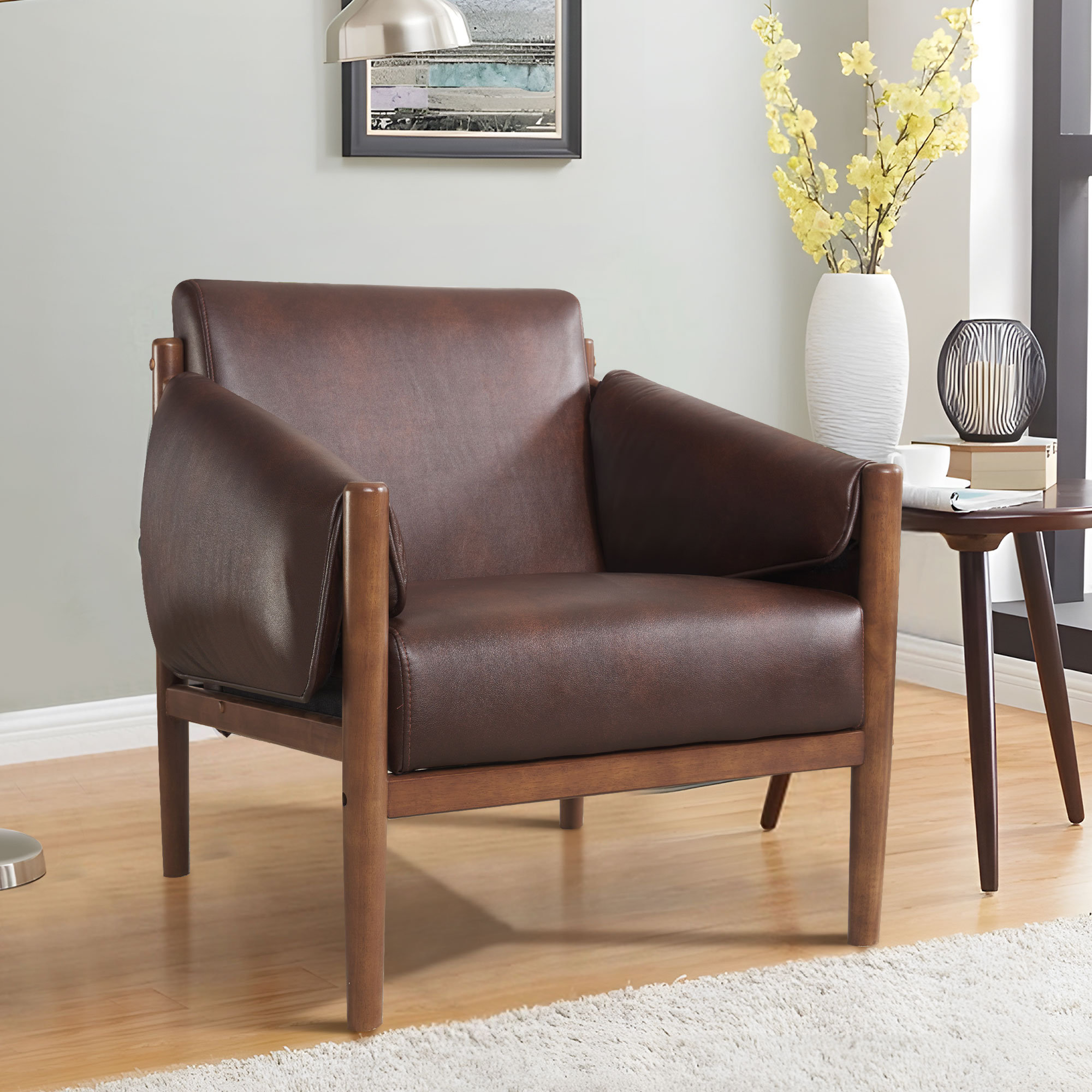 https://assets.wfcdn.com/im/10952765/compr-r85/2538/253849363/jahzir-295-wide-top-leather-upholstered-accent-chair-with-removable-arm-cushions-and-wooden-legs.jpg