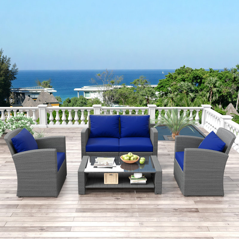 4-Piece Rattan Sofa Seating Group with Tempered Glass Coffee Table and Cushions and Seat Cushions, Blue