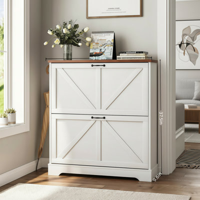 White, Narrow, Farmhouse-Style Entryway Shoe Cabinet With Two Flip-Top Drawers And A Slim Design.