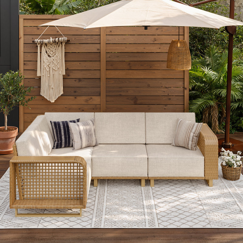 Canapé d'extérieur modulaire en résine tressée pour 4 personnes, avec assise profonde de 61 cm et coussins en oléfine de 25 cm d'épaisseur.