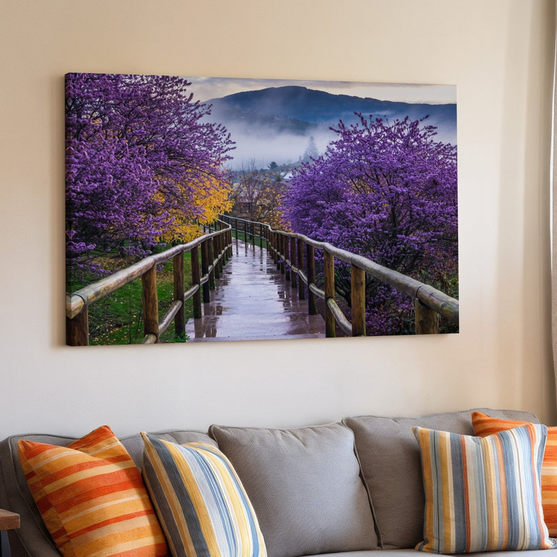 Toile, un sentier serein serpente à travers un paysage animé encadré par des arbres lavande en fleurs et un riche feuillage mauve