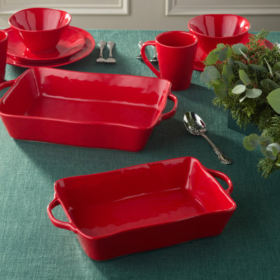 Berry Red Large Rectangular Baker — A 16x10.25x3-inch, 150-ounce stoneware baking dish in glossy holiday red with ornate handles, built for oven-to-table grandeur at every holiday feast.