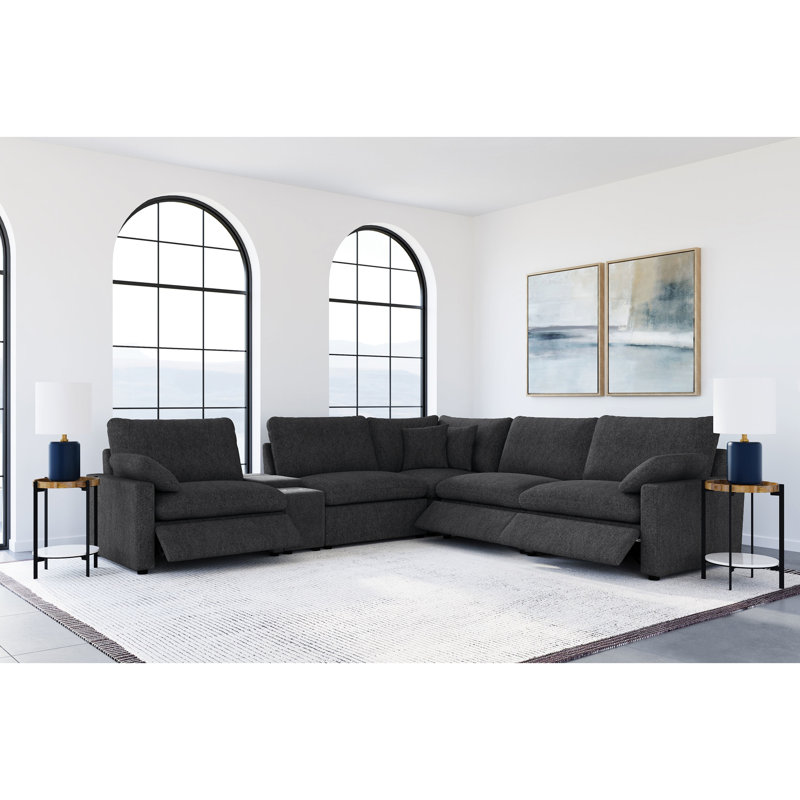 Canapé d'angle modulaire inclinable électrique 6 places gris foncé, idéal pour se détendre et ranger ses affaires, avec un surmatelas confortable pour recevoir.