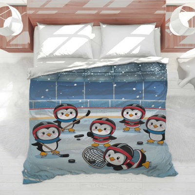 Édredon pingouins jouant au hockey