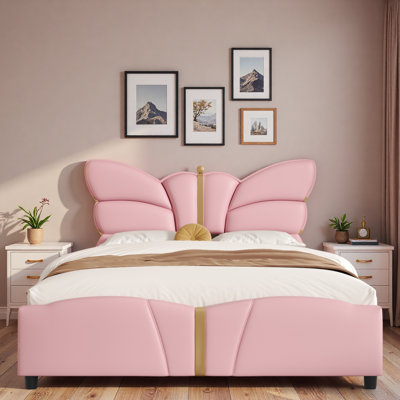 Lit plateforme tapissier avec tête de lit en forme de papillon et décorations en métal doré