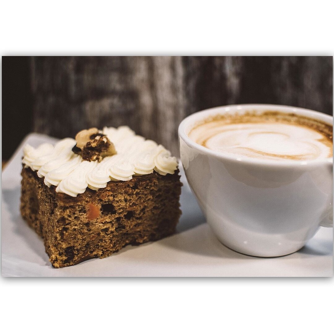 Leinwandbild Cappuccino und ein Stück Kuchen