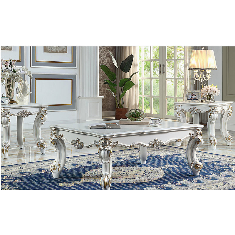 Table basse en perle antique avec pieds en volute