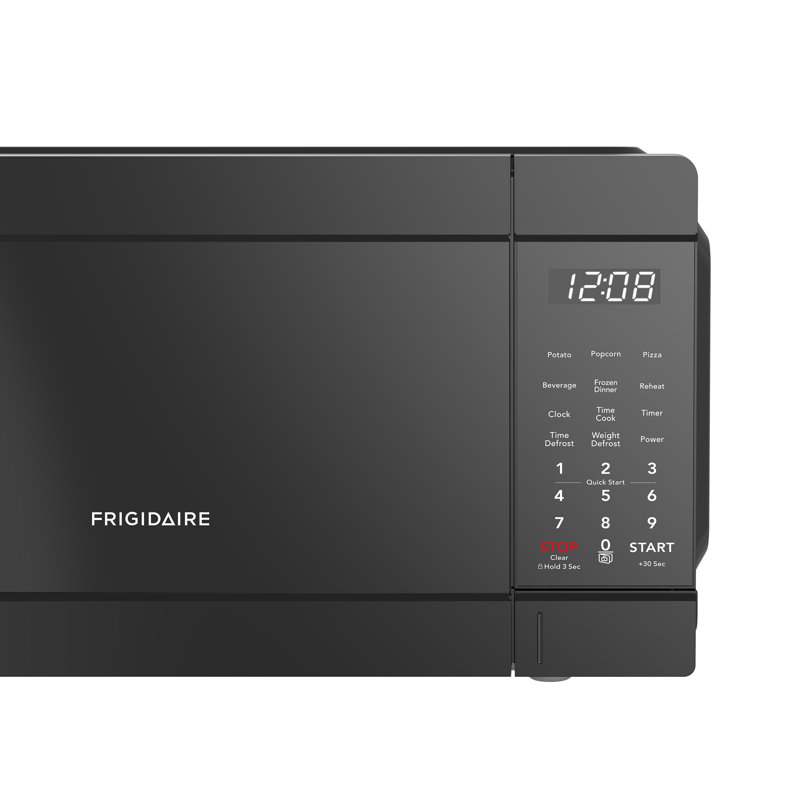Frigidaire Pi. Four à micro-ondes de comptoir, 900 watts avec 10 niveaux de puissance, noir