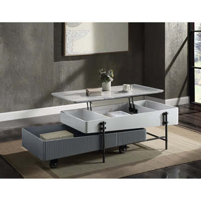 Table basse moderne grise et blanche avec plateau de rangement organisé avec fonction de levage