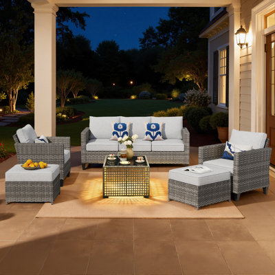 Harbin 7-Person Rattan Sofa Seating Group with Cushions with Coffee Table