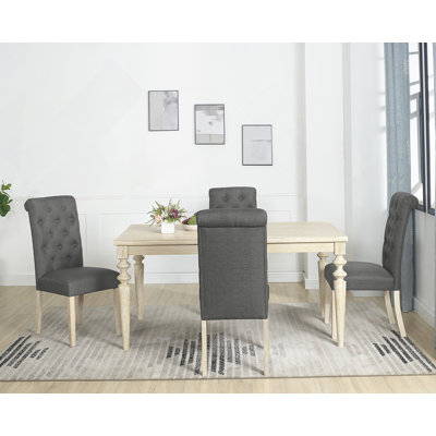 Five-Piece Dining Set With Turned-Leg Dining Table And Four Tufted Chairs For A Stylish And Comfortable Dining Experience