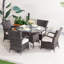 Omied 4 - Person Wicker Patio Dining Set with Round Table , Cushions Included