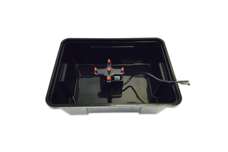 Black plastic storage container with built-in hydronic system.