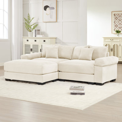 Canapé modulaire surdimensionné en L 82,6 pouces avec repose-pieds, tissu en velours côtelé doux, siège profond, accoudoirs larges, conception ergonomique, 6 coussins décoratifs, assemblage facile, pour les salons, crème