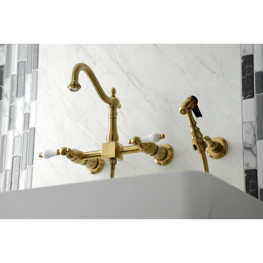 Kingston Brass Heritage Double-Handle 3-Hole Wall-Mount Bridge Kitchen Faucet with Brass Sprayer Kingston Brass 