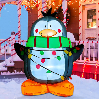 Écharpe gonflable de Noël de 4 pi portant un pingouin de Noël vert avec lumières DEL intégrées