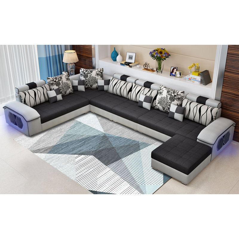 Canapé modulaire réversible en microfibre avec repose-pieds Marialys