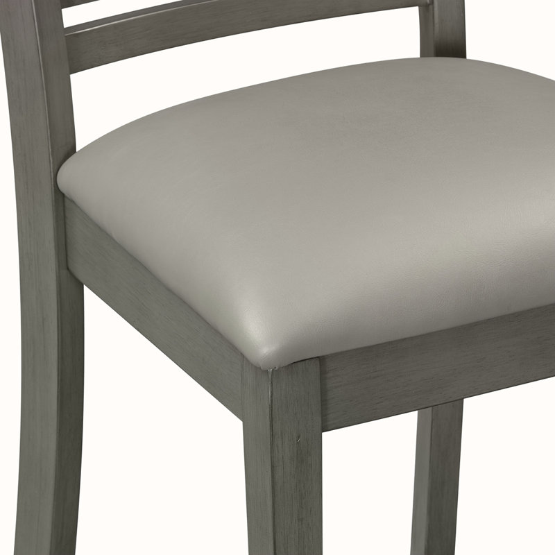 Ensemble de table ronde 5 pièces avec une table de salle à manger en faux marbre et quatre chaises en similicuir