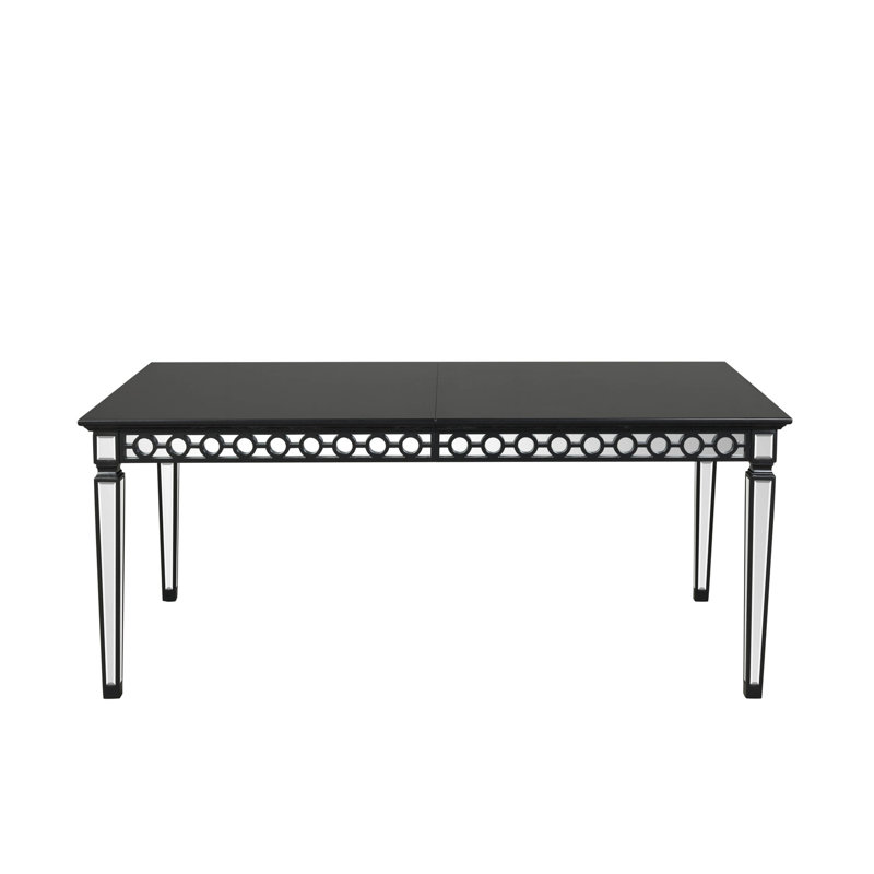 Élégante table de salle à manger noire avec tablier géométrique et plateau rectangulaire en bois avec décoration en miroir