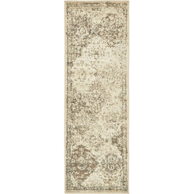 Tapis beige rond à motif floral Levi