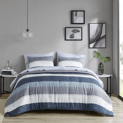 Literie de chambre à coucher moderne avec édredon - gris, bleu marine, agencement de couleurs bleu et rembourrage gris