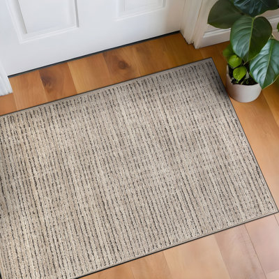 Tapis rayé beige texturé à rayures