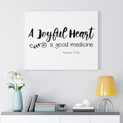 A Joyful Heart Proverbs 17:22 - Wrapped Canvas Print