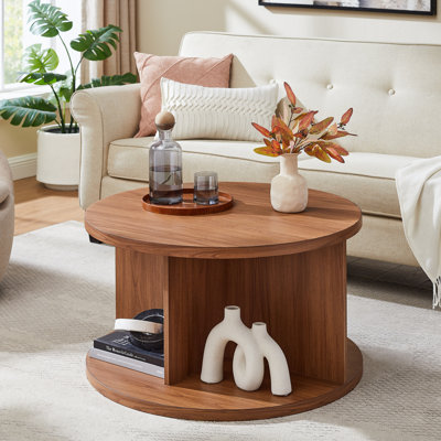 Table basse ronde avec 4 compartiments ouverts pour le rangement