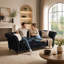 Canapé Chesterfield 3 places en velours capitonné, accoudoirs arrondis, pieds en bois sculpté, 225 cm de large, avec 2 coussins