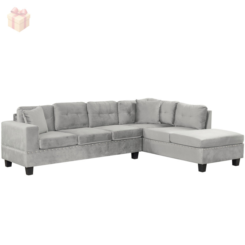 Luxueux canapé modulaire rembourré en velours avec repose-pieds et méridienne réversible, parfait pour les espaces de vie modernes.