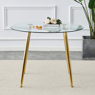 Un plateau de table en verre d'un diamètre de 40 pouces et une table de salle à manger circulaire minimaliste moderne avec des pieds en métal plaqué or. 40 pi x 40 pi x 30 piDT-1164