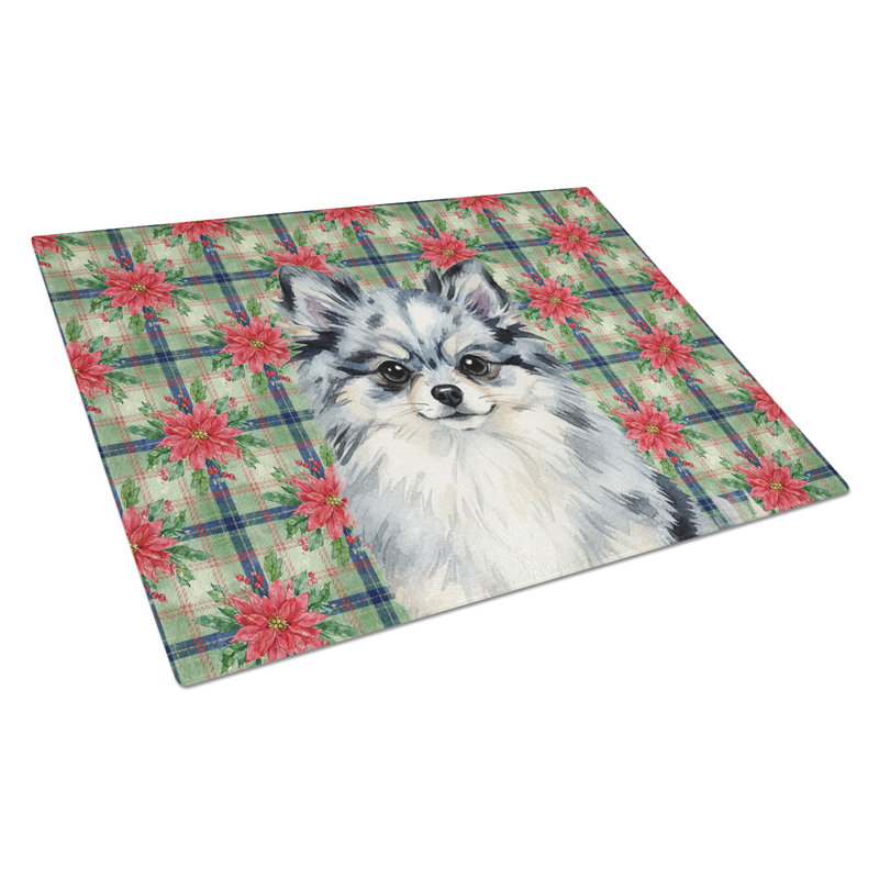 Planche à découper en verre Blue Merle Pomeranian Christmas PoinsettIas