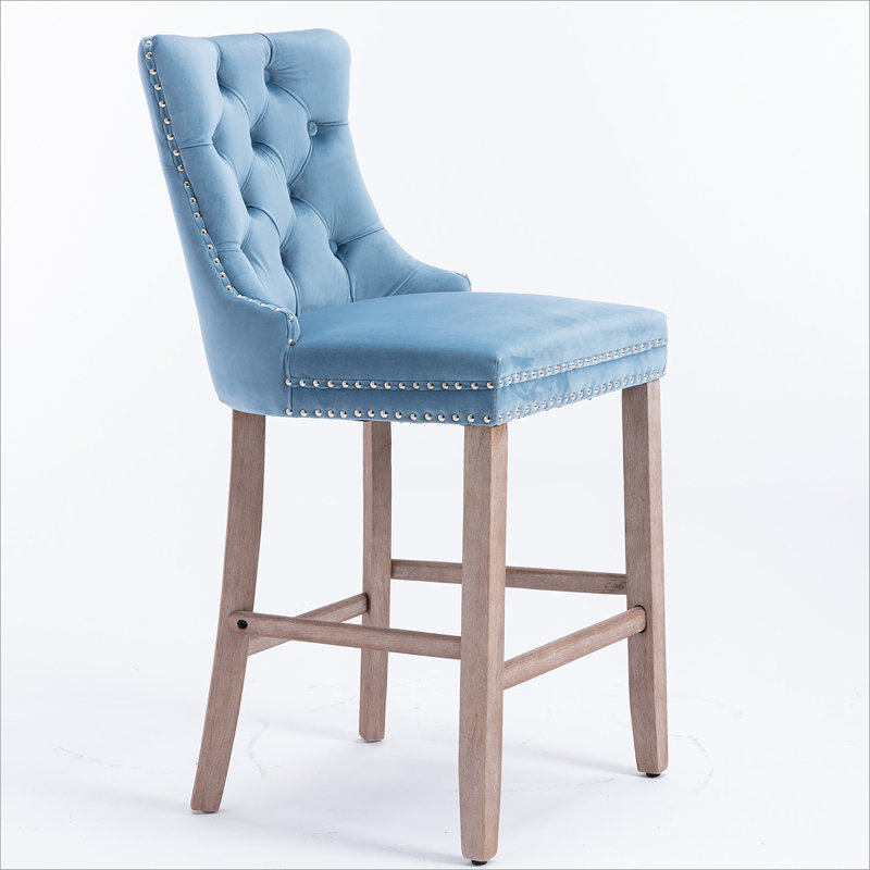 Tabourets de bar rembourrés avec décoration capitonnée et pieds en bois, Bleu clair