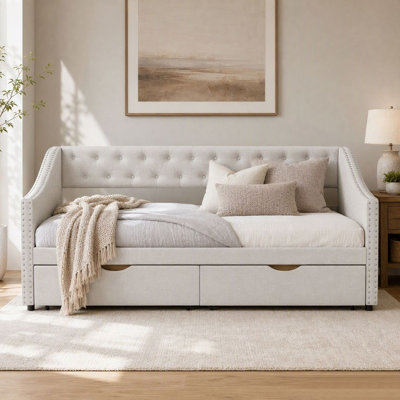 Lit de jour capitonné deux places avec 2 tiroirs de rangement, accoudoirs ornés de clous décoratifs ondulés, dossier capitonné, idéal comme canapé-lit d'appoint pour chambre, chambre d'amis ou salon.