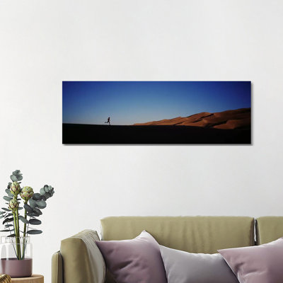 USA, Colorado, Great Sand Dunes National Monument, Runner Jogging In The Park - Wrapped Canvas Panoramic Print