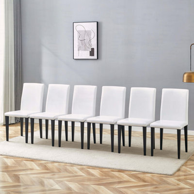 Chaise de salle à manger blanche en polyuréthane avec dossier ergonomique, siège en éponge et pieds en métal noir, ensemble de 6