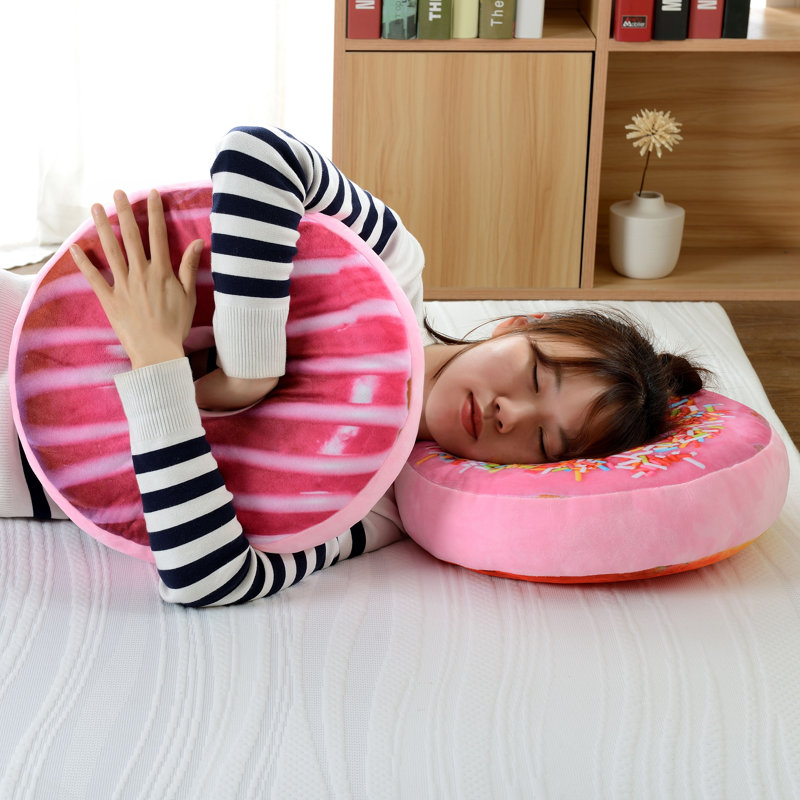 Coussin décoratif réversible en forme de beigne