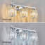 Luminaire de salle de bain moderne à 3 lumières avec abat-jour en cristal et à intensité variable pour une installation au-dessus d'un miroir-1400819348