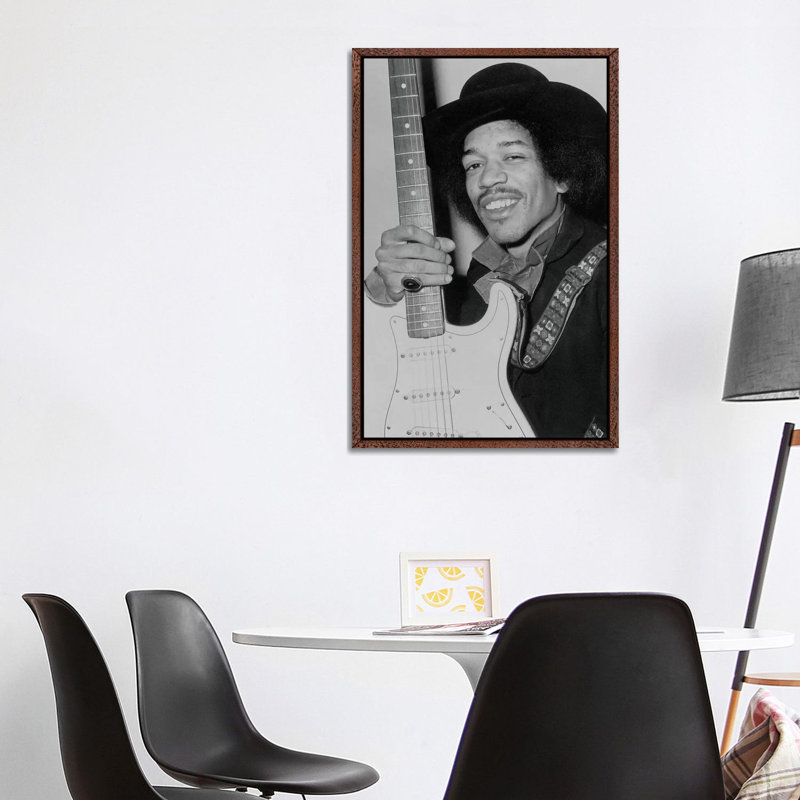 A Smiling Jimi Hendrix Holding His Guitar by Radio Days - Print on Canvas, 101.6 cm H x 66.04 cm W, Classic Brown Wood Framed