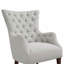 Fauteuil à oreilles capitonné