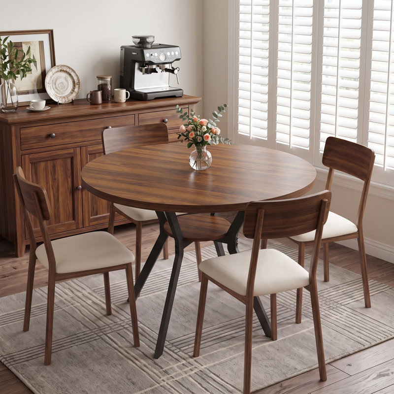 Table de salle à manger ronde de 107 cm de diamètre avec tablette de rangement et piètement en métal pour 4 personnes.
