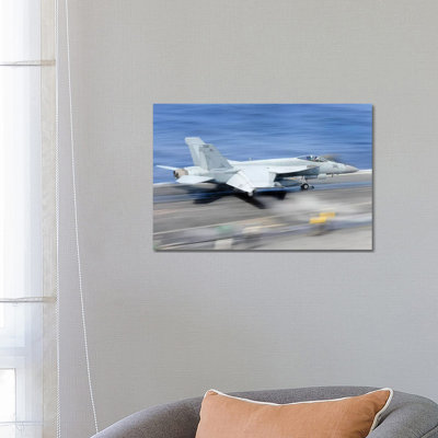 An F/A-18E Super Hornet Launches From The Aircraft Carrier USS George Washington by Stocktrek Images - Wrapped Canvas Print