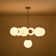 7 - Light Sputnik Design Tiered Chandelier With Globe Shade